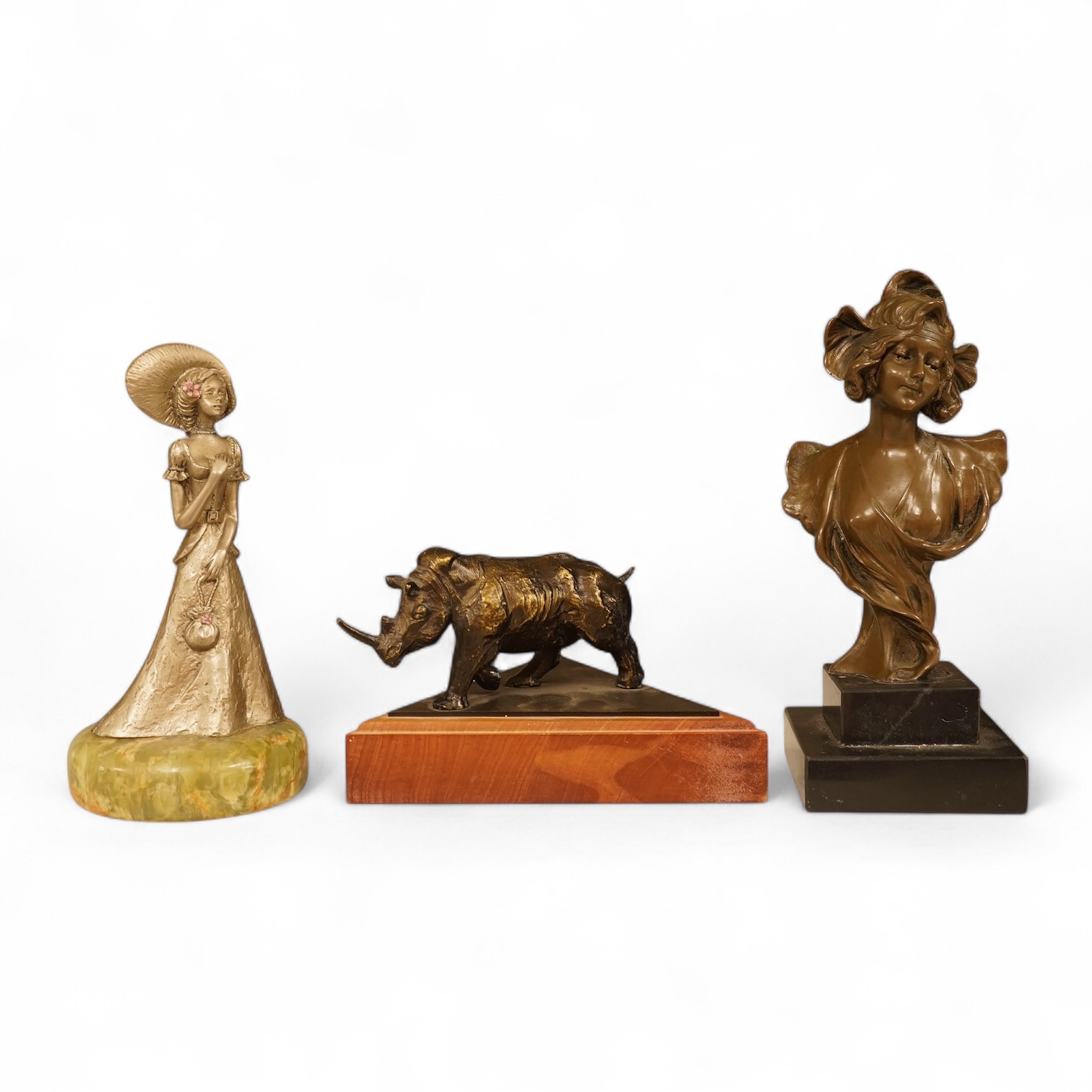 A bronzed rhino, a similar Art Nouveau style lady, and another, largest 19cm high
